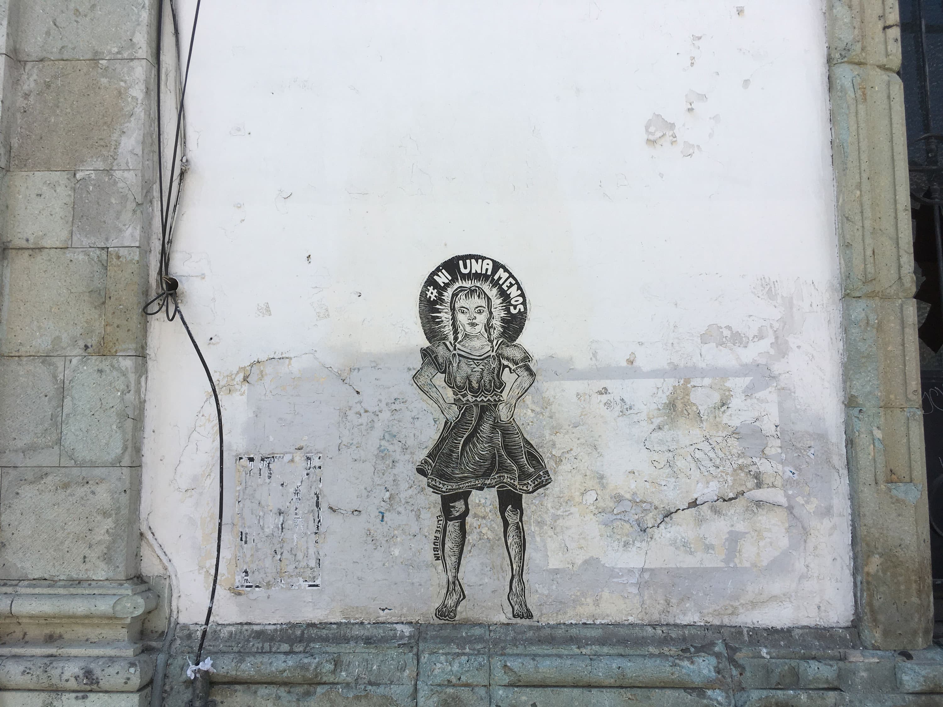 Woodcut by Elise Rubin, on a wall in Oaxaca, Mexico. Photo by the author.