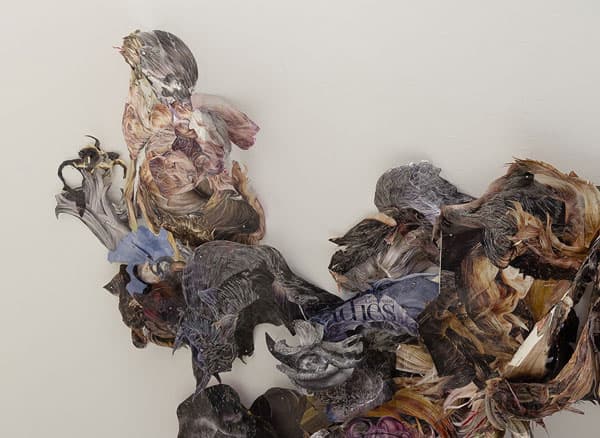 Hedwig Brouckaert, Detail: "a knot, a tangle, a blemish in the eternal smoothness," 2014. Magazine clippings, pins, wire, hair; dimensions variable. Photo credit: Etienne Frossard.